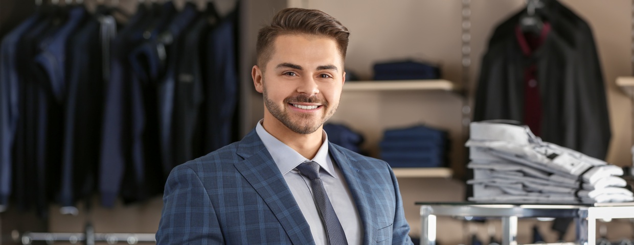 man wearing custom suit, navy plaid