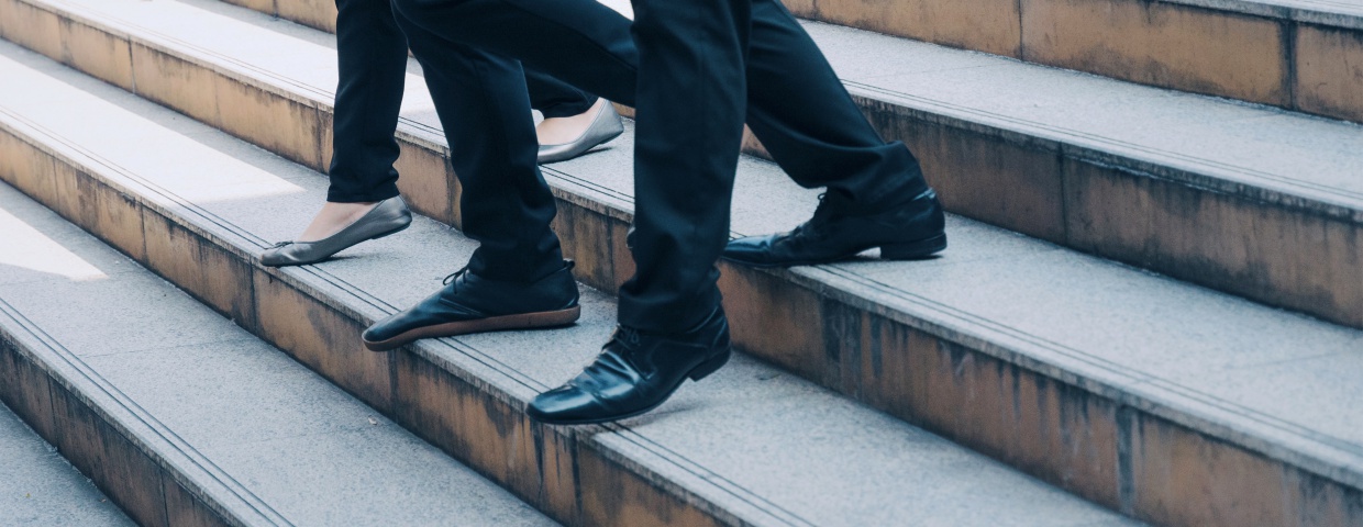 men walking down concrete staircase in dress slacks and dress shoes, lds